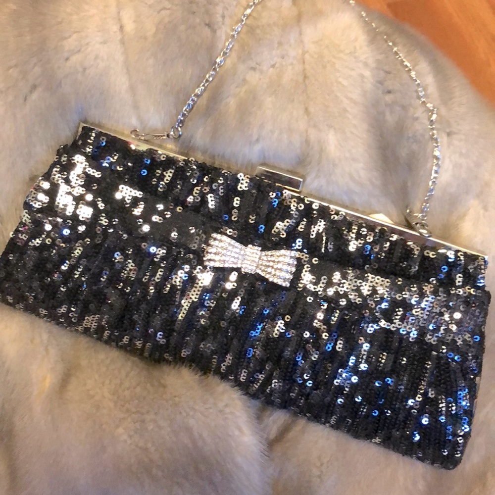 Hand stitched clutch